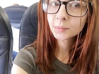 Lovely porn industry star fingers herself in airplane bathroom