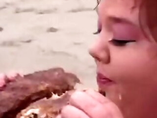 Fat lifeguard bitches eat food on the beach